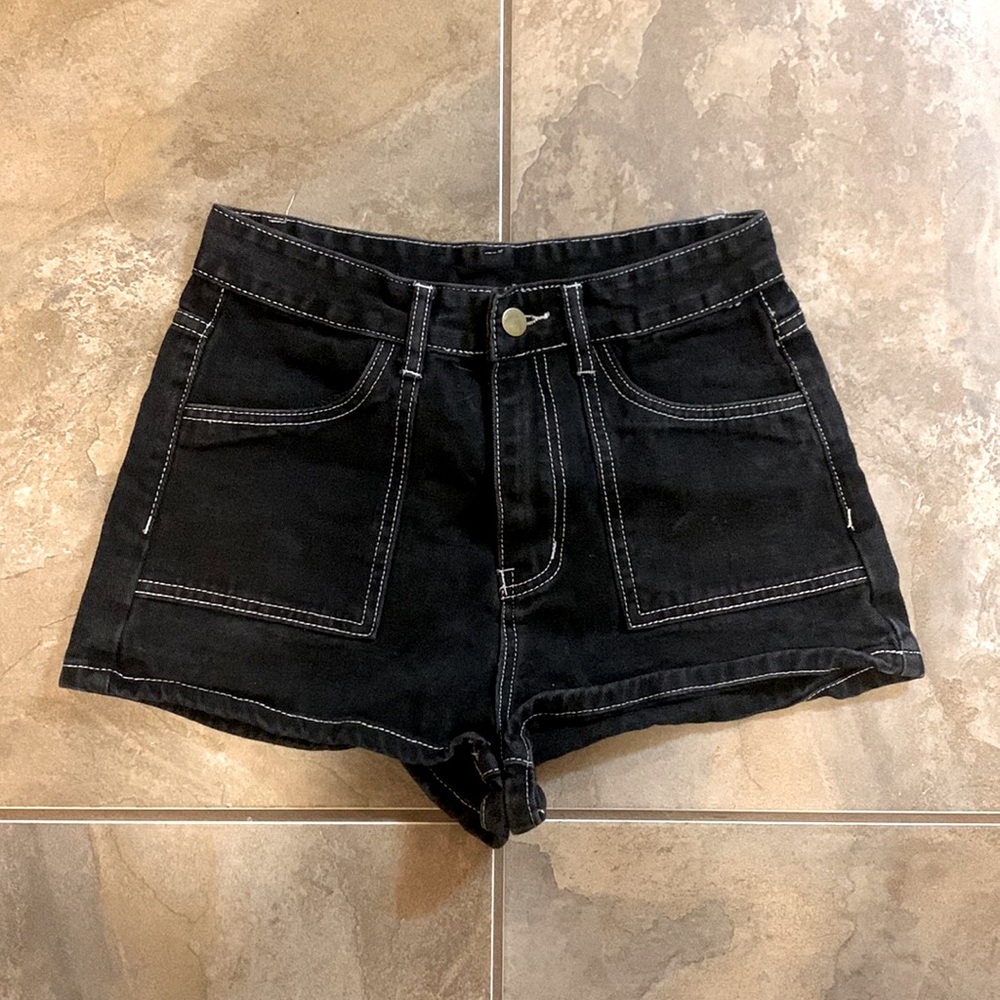 Woman black jean shorts with white detailing